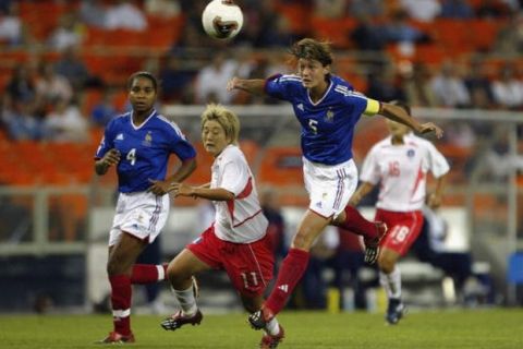 WASHINGTON - SEPTEMBER 24:  Defender Corinne Diacre #5 of France heads the ball during the 2003 FIFA Women's World Cup Group B match against South Korea at RFK Stadium on September 24, 2003 in Washington D.C.  France defeated South Korea 1-0.  (Photo by Doug Pensinger/Getty Images)