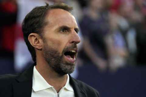 England's manager Gareth Southgate sings the national anthem prior a Group C match between Serbia and England at the Euro 2024 soccer tournament in Gelsenkirchen, Germany, Sunday, June 16, 2024. (AP Photo/Frank Augstein)