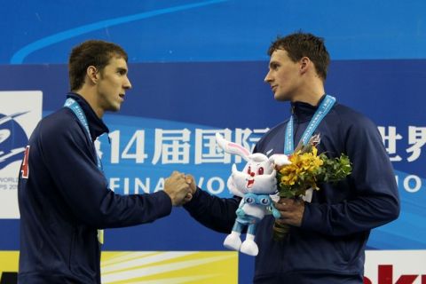 SHANGHAI, CHINA - JULY 26:  Silver medalist Michael Phelps (L) of United States congratulates team mate and gold medalist Ryan Lochte after the Men's 200m Freestyle Final during Day Eleven of the 14th FINA World Championships at the Oriental Sports Center on July 26, 2011 in Shanghai, China.  (Photo by Clive Rose/Getty Images)