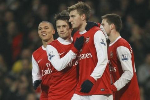 Arsenal's Nicklas Bendtner, No 52 celebrates after scoring a goal against with team mates Tomas Rosickym second left and Conor Henderson, right Leyton Orient's during their English FA Cup fifth round replay at Arsenal's Emirates stadium in London, Wednesday, March  2, 2011 . (AP Photo/Alastair Grant)   NO INTERNET/MOBILE USAGE WITHOUT FOOTBALL ASSOCIATION PREMIER LEAGUE(FAPL)LICENCE. CALL +44 (0) 20 7864 9121 or EMAIL info@football-dataco.com <mailto:info@football-dataco.com> FOR DETAILS