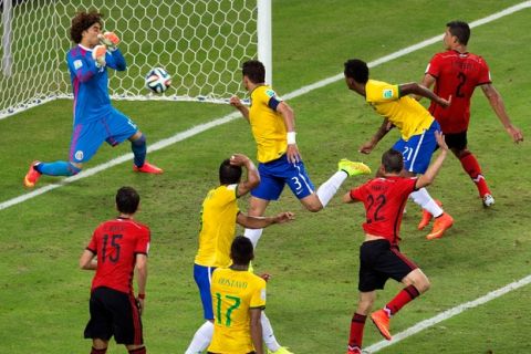 FORTALEZA, BRAZIL - JUNE 17:  Guillermo Ochoa of Mexico makes a save after a header by Thiago Silva of Brazil during the 2014 FIFA World Cup Brazil Group A match between Brazil and Mexico at Castelao on June 17, 2014 in Fortaleza, Brazil.  (Photo by Miguel Tovar/Getty Images)