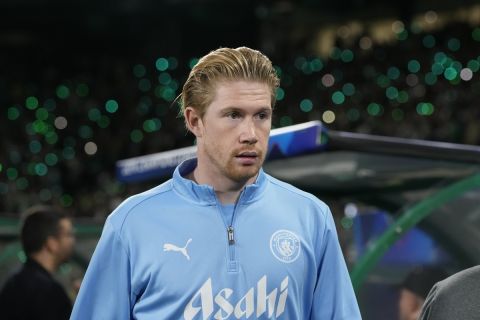 Manchester City's Kevin De Bruyne walks to the bench before the UEFA Champions League opening phase match between Sporting and Manchester City in Lisbon, Portugal, Tuesday, Nov. 5, 2024. (AP Photo/Armando Franca)