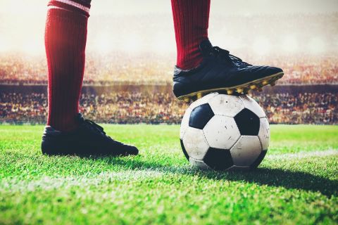 soccer football player tread on the ball at kick off line