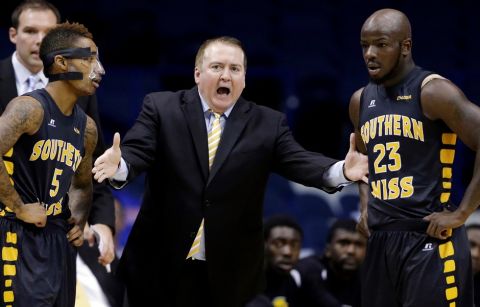 FILE - In this Nov. 13, 2013 file photo, then-Southern Mississippi head coach Donnie Tyndall, center, talks to guards Neil Watson, left, and Jerrold Brooks during the first half of an NCAA college basketball game against DePaul, in Rosemont, Ill. An attorney for former Southern Mississippi basketball coach Donnie Tyndall says the coach's NCAA infractions case appeal hearing will be on Thursday, Sept. 8, 2016,  in Indianapolis. (AP Photo/Nam Y. Huh, File)