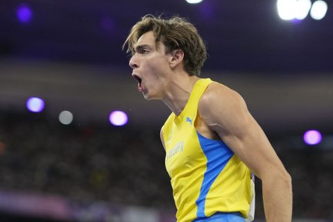 Armand Duplantis, of Sweden, reacts during the men's pole vault final at the 2024 Summer Olympics, Monday, Aug. 5, 2024, in Saint-Denis, France.(AP Photo/Bernat Armangue)