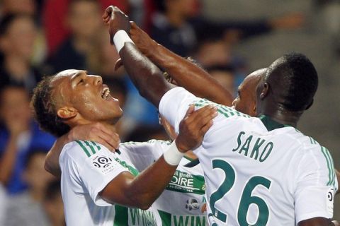 Pierre Emerick Aubameyang (L) celebrates with his team mate Bakary Sako (R) during their French Ligue 1 soccer match against Girondins Bordeaux at the Chaban Delmas Stadium in Bordeaux August 7, 2011. REUTERS/Regis Duvignau (FRANCE - Tags: SPORT SOCCER)