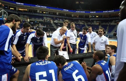 ISTANBUL, TURKEY - SEPTEMBER 24: Dusan Ivkovic (4th L), head coach of Anadolu Efes, speaks to his player during the Gloria Cup 2014 basketball match between Unicaja Malaga and Anadolu Efes at Ulker Sports Arena in Istanbul, Turkey on September 24, 2014. (Photo by Ahmet Dumanli/Anadolu Agency/Getty Images)