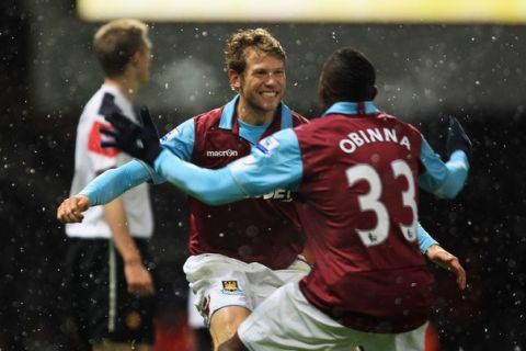 LONDON, ENGLAND - NOVEMBER 30: Jonathan Spector of West Ham United celebrates his goal with Victor Obinna during the Carling Cup Quarter Final match between West Ham United and Manchester United at the Boleyn Ground on November 30, 2010 in London, England.  (Photo by Mark Thompson/Getty Images)