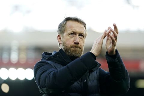 Brighton's head coach Graham Potter applauds at the end of the English Premier League soccer match between Liverpool and Brighton and Hove Albion at Anfield Stadium, Liverpool, England, Saturday, Oct. 30, 2021. (AP Photo/Jon Super)