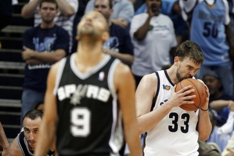 Memphis Grizzlies' Marc Gasol (R) of Spain reacts after being called for a foul against the San Antonio Spurs during the second half of Game 4 of their Western Conference first round NBA basketball playoffs in Memphis, Tennessee April 25, 2011.  REUTERS/Mark Weber (UNITED STATES - Tags: SPORT BASKETBALL)