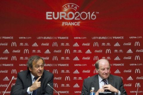 UEFA President Michel Platini (L) and  President of Euro 2016 Jacques Lambert attend a meeting to establish the steering committee of UEFA EURO 2016 at the French Football Federation (FFF) headquarters in Paris April 21, 2011. REUTERS/Gonzalo Fuentes (FRANCE - Tags: SPORT SOCCER)