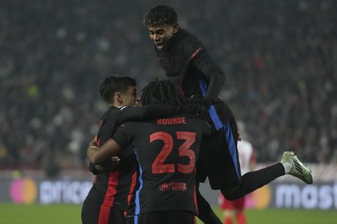 Barcelona players celebrate after a goal during the Champions League opening phase soccer match between Red Star and Barcelona at the Rajko Mitic Stadium in Belgrade, Serbia, Wednesday, Nov. 6, 2024. (AP Photo/Darko Vojinovic)