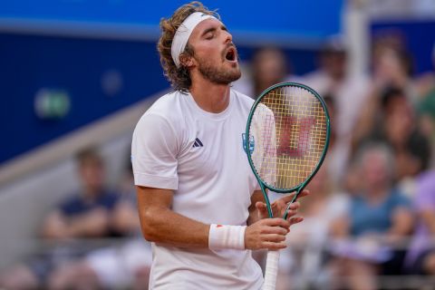 Stefanos Tsitsipas of Greece reacts during his match against Serbia's Novak Djokovic during their men's quarter-final match at the Roland Garros stadium, at the 2024 Summer Olympics, Thursday, Aug. 1, 2024, in Paris, France. (AP Photo/Manu Fernandez)