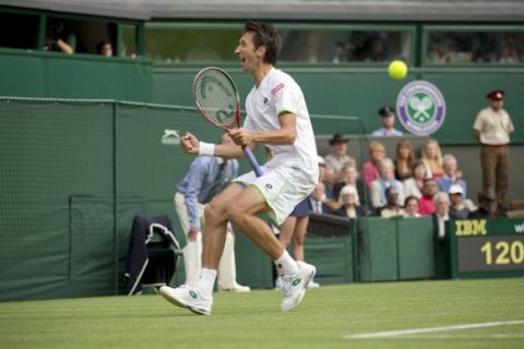 Jun 26, 2013; London, United Kingdom; Sergiy Stakhovsky (UKR) celebrates after recording match point against Roger Federer (SUI) on day three of the 2013 Wimbledon Championships at the All England Lawn Tennis Club. Mandatory Credit: Susan Mullane-USA TODAY Sports ORG XMIT: USATSI-133412 ORIG FILE ID:  20130626_jla_au2_228.jpg