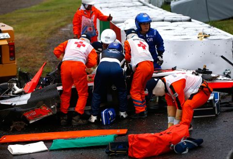 SUZUKA, JAPAN - OCTOBER 05:  Jules Bianchi of France and Marussia receives urgent medical treatment after crashing during the Japanese Formula One Grand Prix at Suzuka Circuit on October 5, 2014 in Suzuka, Japan.  (Photo by Getty Images/Getty Images)