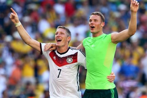 RIO DE JANEIRO, BRAZIL - JULY 04:  Bastian Schweinsteiger and goalkeeper Manuel Neuer of Germany celebrate victory after defeating France 1-0 in the 2014 FIFA World Cup Brazil Quarter Final match between France and Germany at Maracana on July 4, 2014 in Rio de Janeiro, Brazil.  (Photo by Jamie Squire/Getty Images)