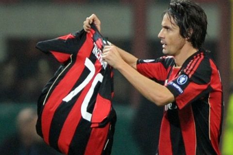 AC Milan's forward Filippo Inzaghi waves the jersey of Brazilian forward Robinho after scoring his second goal agaisnt Real Madrid during their Champions League Group G football match on November 3, 2010 at San Siro stadium in Milan.  AFP PHOTO / GIUSEPPE CACACE (Photo credit should read GIUSEPPE CACACE/AFP/Getty Images)