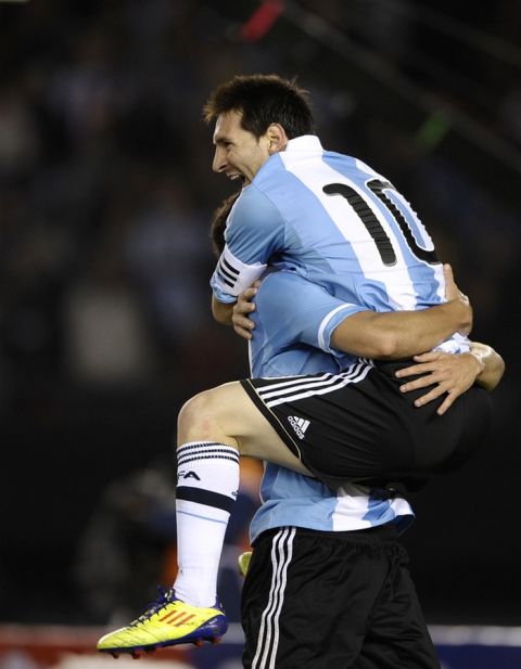 Argentine Gonzalo Higuain (L) celebrates with teammate Lionel Messi after scoring against Chile during a Brazil 2014 World Cup South American qualifier match held at the Monumental stadium in Buenos Aires on October 7, 2011. Argentina won 4-1. AFP PHOTO / ALEJANDRO PAGNI (Photo credit should read ALEJANDRO PAGNI/AFP/Getty Images)