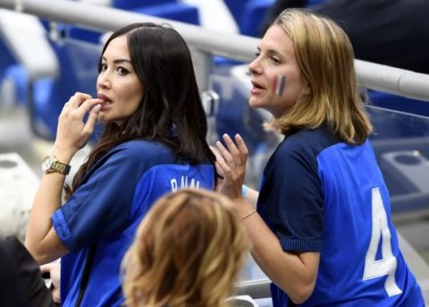 France's defender Adil Rami's partner Sidonie Biemont (L) is pictured ahead of the Euro 2016 group A football match between France and Romania at Stade de France, in Saint-Denis, north of Paris, on June 10, 2016. / AFP PHOTO / MIGUEL MEDINA