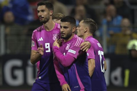 German players celebrate after a goal during the Nations League soccer match between Bosnia and Germany in Zenica, Bosnia and Herzegovina, on Friday, Oct. 11, 2024. (AP Photo/Armin Durgut)