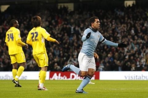 Manchester City's Carlos Tevez, right, celebrates after scoring against Leicester during their English FA Cup third round replay soccer match at The City of Manchester Stadium, Manchester, England, Tuesday Jan. 18, 2011. (AP Photo/Jon Super)   NO INTERNET/MOBILE USAGE WITHOUT FOOTBALL ASSOCIATION PREMIER LEAGUE(FAPL)LICENCE. EMAIL info@football-dataco.com FOR DETAILS. 