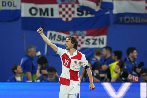 Croatia's Luka Modric celebrates after scoring his side's opening goal during a Group B match between Croatia and Italy at the Euro 2024 soccer tournament in Leipzig, Germany, Monday, June 24, 2024. (AP Photo/Petr David Josek)