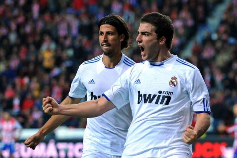 GIJON, SPAIN - NOVEMBER 14:  Gonzalo Higuain (R) of Real Madrid celebrates beside team mate Sami Khedira after scoring Real's first goal during the La Liga match between Sporting Gijon and Real Madrid at El Molinon Stadium on November 14, 2010 in Gijon, Spain.  (Photo by Denis Doyle/Getty Images)