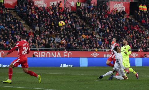 FC Barcelona's Lionel Messi, right, kicks the ball to score his side's second goal during the Spanish La Liga soccer match between Girona and FC Barcelona at the Montilivi stadium in Girona, Spain, Sunday, Jan. 27, 2019. (AP Photo/Manu Fernandez)