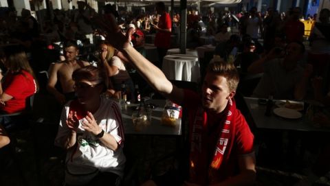 Liverpool fans sing at Plaza Mayor square in downtown Madrid, Spain, Thursday, May 30, 2019. Madrid will be hosting the final again after nearly a decade, but the country's streak of having at least one team playing for the European title ended this year after five straight seasons, giving home fans little to cheer for when Liverpool faces Tottenham at the Wanda Metropolitano Stadium on Saturday. (AP Photo/Manu Fernandez)