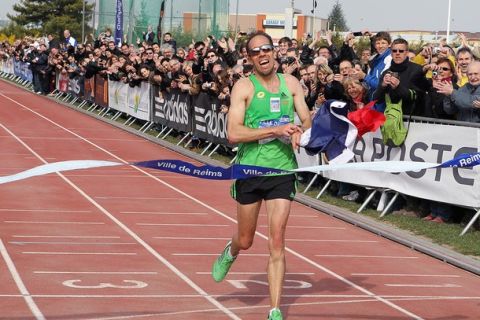 French athlete Yohann Diniz crosses the finish line, on March 12, 2011, in Reims, northeastern France, to become the 50000 m walk (50km walk) world champion with a time of 3:35.27. The former record was detained by French Thierry Toutain with 3:40.57, in 1996.AFP PHOTO / FRANCOIS NASCIMBENI (Photo credit should read FRANCOIS NASCIMBENI/AFP/Getty Images)