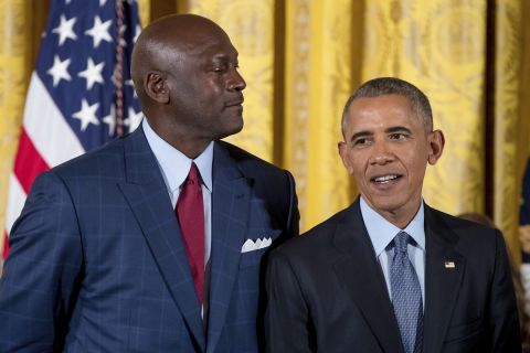 President Barack Obama, stands next to former NBA basketball player Michael Jordan, left, as he playfully looms over him at a Presidential Medal of Freedom ceremony in the East Room of the White House, Tuesday, Nov. 22, 2016, in Washington.  (AP Photo/Andrew Harnik)