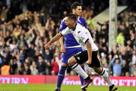 Fulham's US midfielder Clint Dempsey celebrates scoring against Bolton Wanderers during their English Premier League football match at Craven Cottage in London on April 27, 2011. AFP PHOTO/GLYN KIRK FOR EDITORIAL USE ONLY Additional licence required for any commercial/promotional use or use on TV or internet (except identical online version of newspaper) of Premier League/Football League photos. Tel DataCo +44 207 2981656. Do not alter/modify photo. (Photo credit should read GLYN KIRK/AFP/Getty Images)