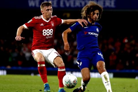 Chelsea's Ethan Ampadu, right, vies for the ball with Nottingham Forest's Ben Osborn during the English League Cup soccer match between Chelsea and Nottingham Forest at Stamford Bridge stadium in London, Wednesday, Sept. 20, 2017. (AP Photo/Kirsty Wigglesworth)