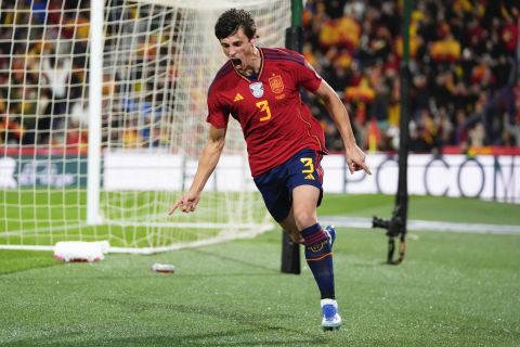 Spain's Robin Le Normand, right, reacts after scoring his team's first goal during the Euro 2024 group A qualifying soccer match between Spain and Georgia at Jose Zorrilla Stadium in Valladolid, Spain, Sunday, Nov. 19 23, 2023. (AP Photo/Manu Fernandez)