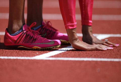 EUGENE, OR - JUNE 01:  A detail of Sanya Richards-Ross shoes and hands before the 400m during day 2 of the IAAF Diamond League Prefontaine Classic on June 1, 2013 at the Hayward Field in Eugene, Oregon.  (Photo by Jonathan Ferrey/Getty Images)