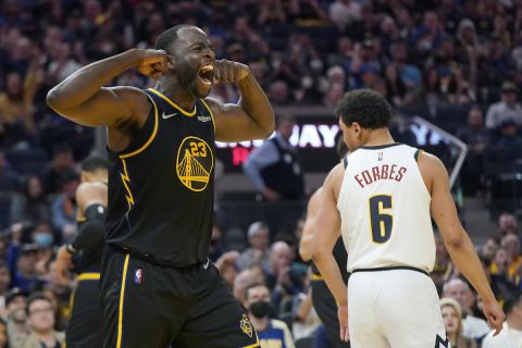 Golden State Warriors forward Draymond Green celebrates after scoring against the Denver Nuggets during the second half of Game 1 of an NBA basketball first-round playoff series in San Francisco, Saturday, April 16, 2022. (AP Photo/Jeff Chiu)