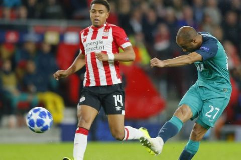 Tottenham midfielder Lucas Lucas soots on goal as PSV's Donyell Malen runs alongside during a Group B Champions League soccer match between PSV Eindhoven and Tottenham Hotspur at the Philips stadium in Eindhoven, Netherlands, Wednesday, Oct. 24, 2018. (AP Photo/Peter Dejong)