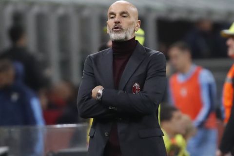 AC Milan's manager Stefano Pioli reacts during the Serie A soccer match between AC Milan and Lazio at the San Siro stadium, in Milan, Italy, Sunday, Nov. 3, 2019, (AP Photo/Antonio Calanni)