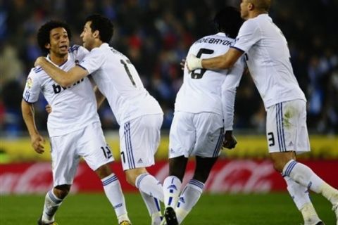 CORRECTS NAME OF PLAYER -  Real Madrid's  Marcelo from Brazil, left, reacts after scoring against Espanyol during a Spanish La Liga soccer match at Cornella-El Prat stadium in Cornella Llobregat, Spain, Sunday, Feb. 13, 2011. (AP Photo/Manu Fernandez)