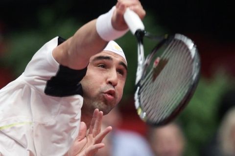 Marcos Baghdatis of Cyprus serves to Michael Berrer of Germany in their quarter final tennis match during the Vienna Open October 29, 2010. REUTERS/Heinz-Peter Bader  (AUSTRIA - Tags: SPORT TENNIS)