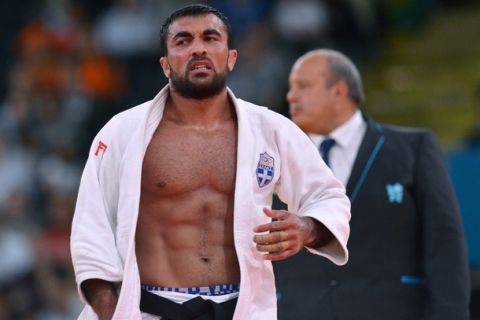 Greece's Ilias Iliadis reacts after losing his men's -90kg judo contest quarter final match of the London 2012 Olympic Games on August 1, 2012 at the ExCel arena in London. AFP PHOTO / JOHANNES EISELE        (Photo credit should read JOHANNES EISELE/AFP/GettyImages)