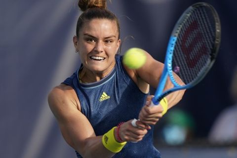 Maria Sakkari, of Greece, returns a shot during the Miami Open tennis tournament, Monday, March 29, 2021, in Miami Gardens, Fla. (AP Photo/Wilfredo Lee)