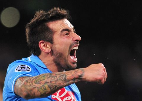 Napoli's Argentine forward Ezequiel Ivan Lavezzi celebrates after scoring during the Champions League round of 16 first leg football match, Napoli vs Chelsea at San Paolo stadium in Naples on February 21, 2012.   AFP PHOTO / ALBERTO PIZZOLI (Photo credit should read ALBERTO PIZZOLI/AFP/Getty Images)