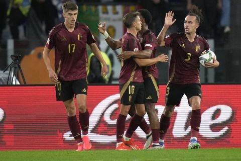 Belgium's Leandro Trossard, third right, celebrates with teammates after scoring his sides second goal during the UEFA Nations League soccer match between Italy and Belgium at the Stadio Olimpico in Rome, Italy, on Thursday, Oct. 10, 2024. (AP Photo/Alessandra Tarantino)