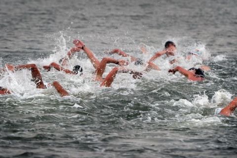 Competitors swim during the men's 10km open water swimming event of the FINA World Championships at Jinshan Beach in Shanghai on July 20, 2011.  AFP PHOTO / MARK RALSTON (Photo credit should read MARK RALSTON/AFP/Getty Images)