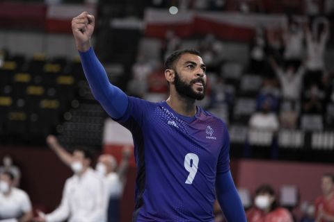 France's Earvin Ngapeth raises his right fist during a men's volleyball quarterfinal match against Poland, at the 2020 Summer Olympics, Tuesday, Aug. 3, 2021, in Tokyo, Japan. (AP Photo/Manu Fernandez)