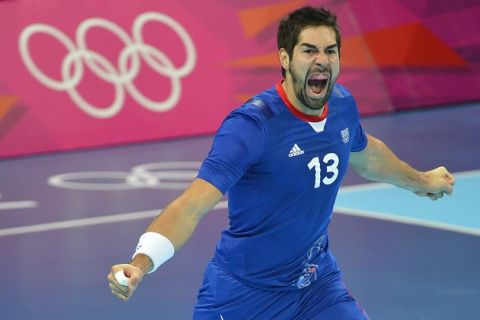 France's centreback Nikola Karabatic reacts during the men's semi-final handball match France vs Croatia for the London 2012 Olympics Games on August 10, 2012 at the Basketball Arena in London.    AFP PHOTO / ODD ANDERSEN        (Photo credit should read ODD ANDERSEN/AFP/GettyImages)