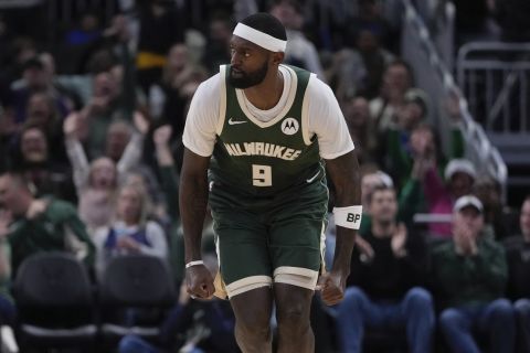 Milwaukee Bucks' Bobby Portis reacts after a three pointer during the first half of an NBA basketball game Saturday, Dec. 21, 2024, in Milwaukee. (AP Photo/Morry Gash)