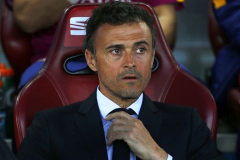 Barcelona coach Luis Enrique sits on the bench ahead of the final of the Copa del Rey soccer match between FC Barcelona and Sevilla FC at the Vicente Calderon stadium in Madrid, Sunday, May 22, 2016. (AP Photo/Francisco Seco)