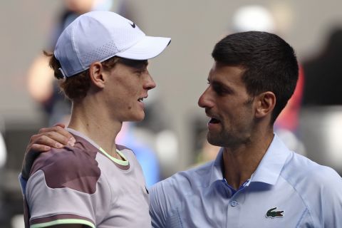 Jannik Sinner, left, of Italy is congratulated by Novak Djokovic of Serbia following their semifinal at the Australian Open tennis championships at Melbourne Park, Melbourne, Australia, Friday, Jan. 26, 2024. (AP Photo/Asanka Brendon Ratnayake)